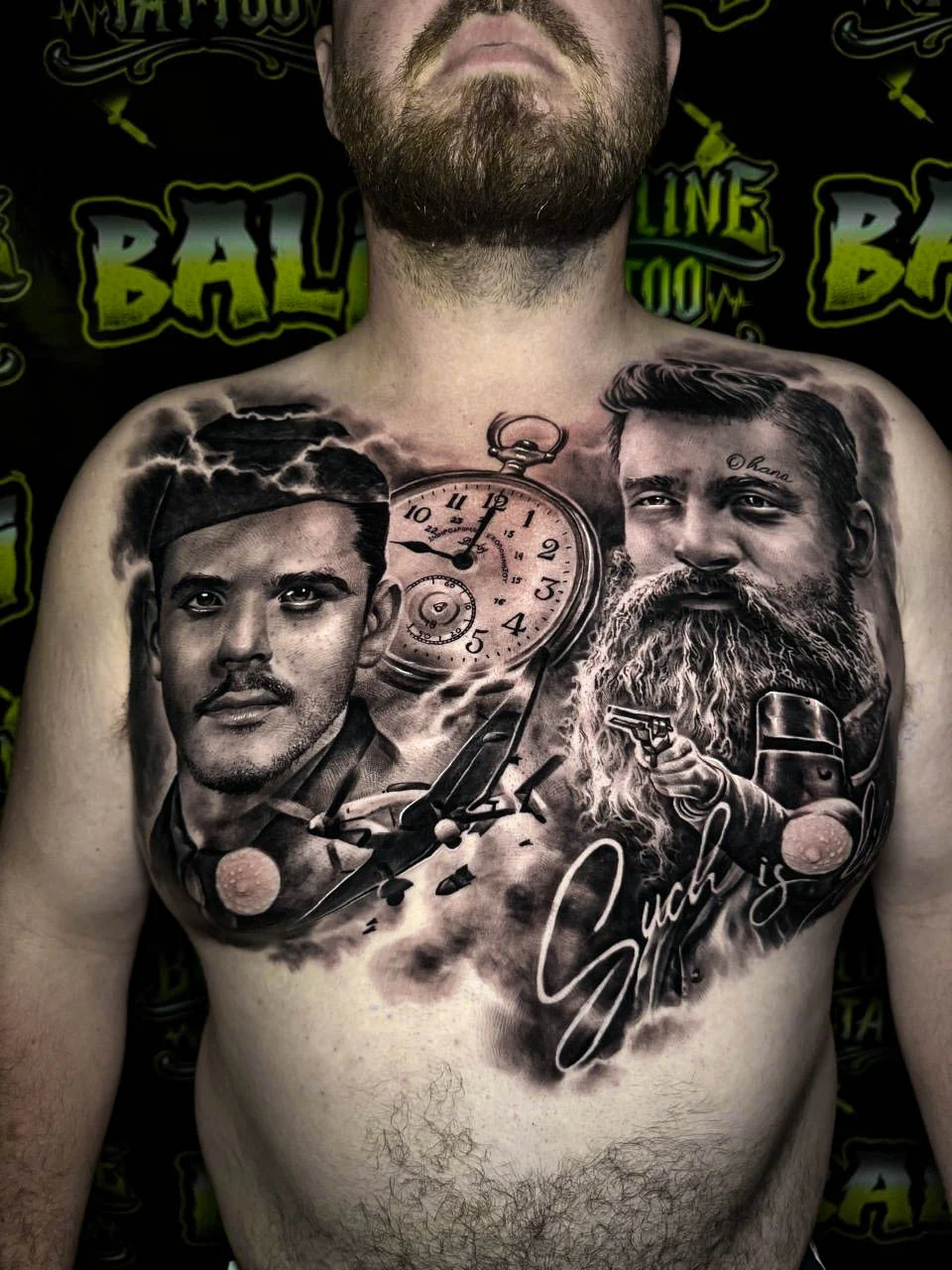 Black and grey portrait realism chest tattoo featuring two memorial male portraits, a pocket watch, airplane, microphone, and signature at Bloodline Tattoo Bali.